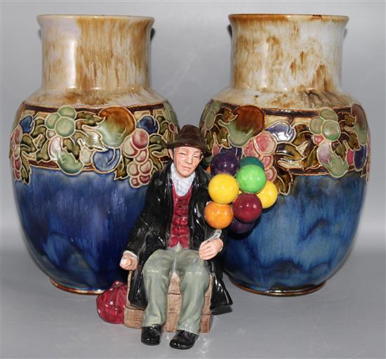 A pair of Royal Doulton stoneware vases and a figure The Balloon Man HN1954